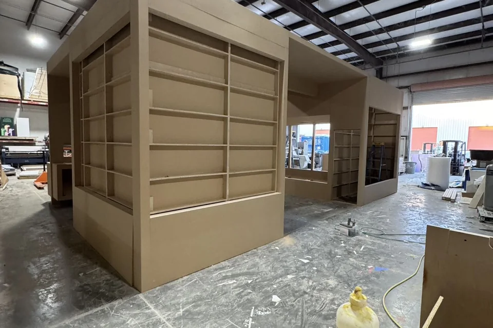 Ultimea booth shell progressing through workshop assembly