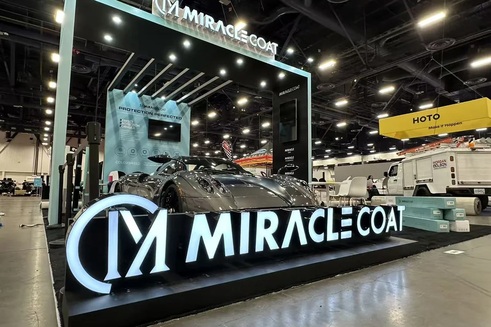 Front view of the MiracleCoat custom booth at SEMA 2025