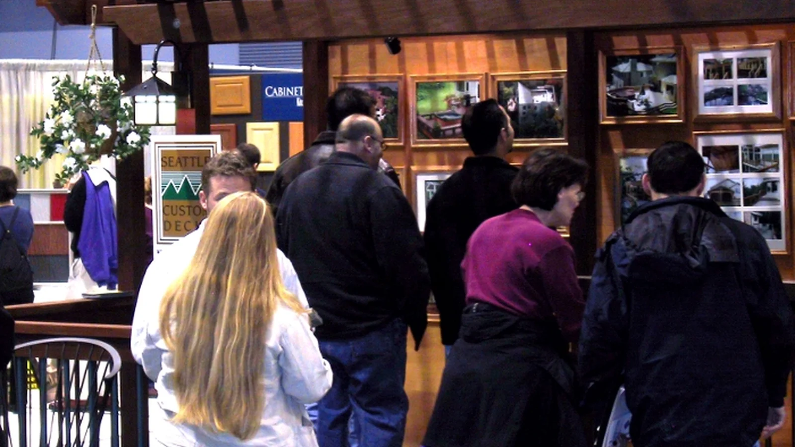 Visitors comparing home improvement exhibits at the Northwest Remodeling Expo in Seattle