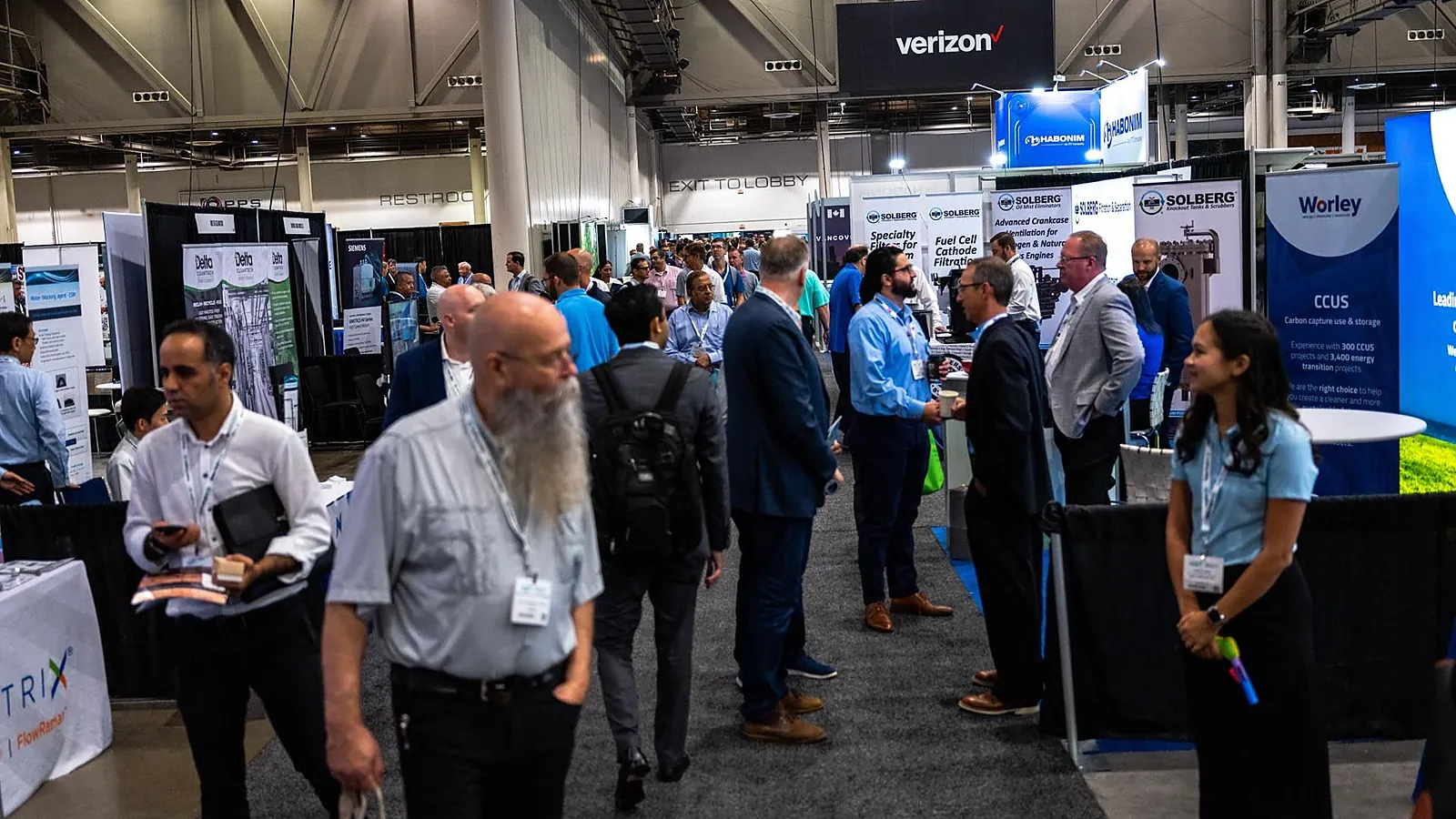 Attendees meet exhibitors at Carbon Capture Technology Expo North America in Houston.