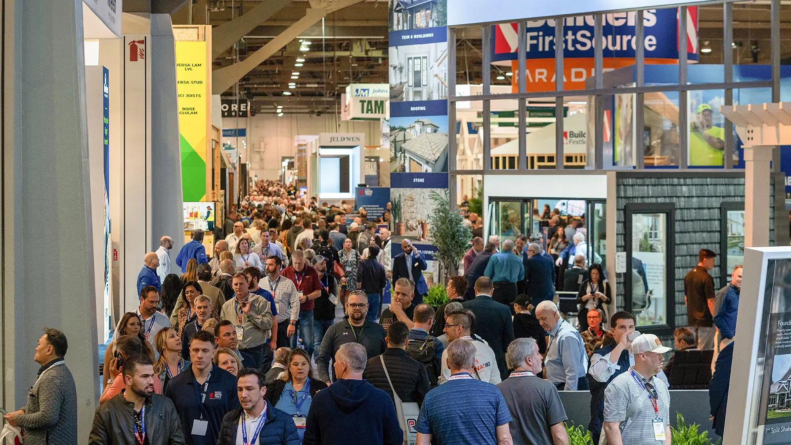 A busy NAHB International Builders' Show aisle with building-product exhibits.