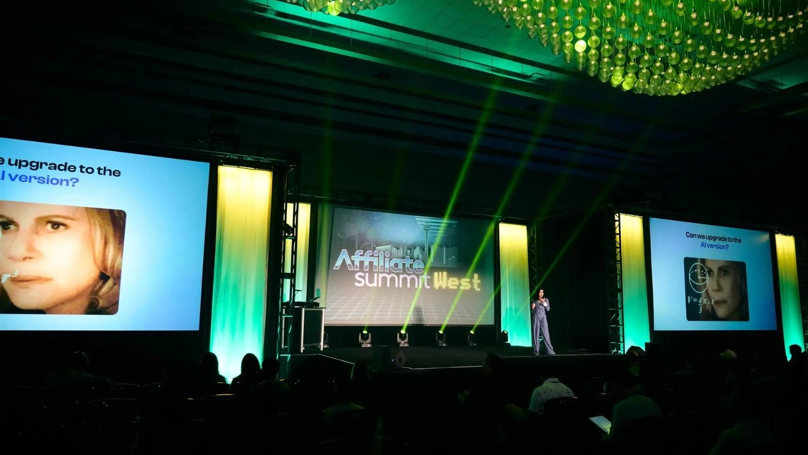 Affiliate Summit West keynote stage with an audience and green lighting.