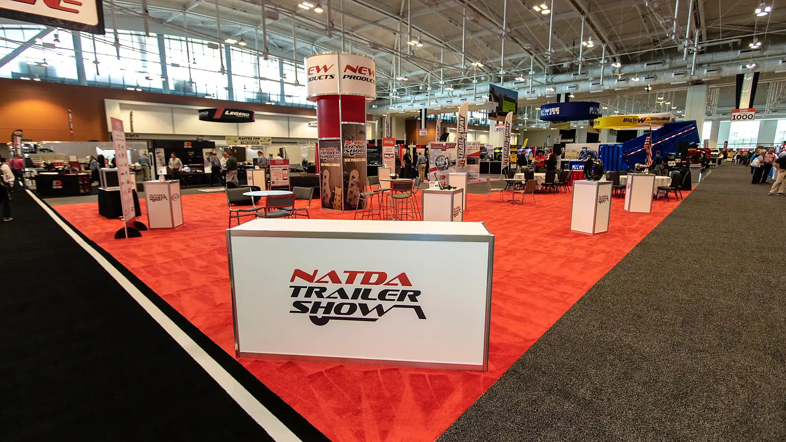 NATDA Trailer Show expo hall with trailer displays and dealer attendees