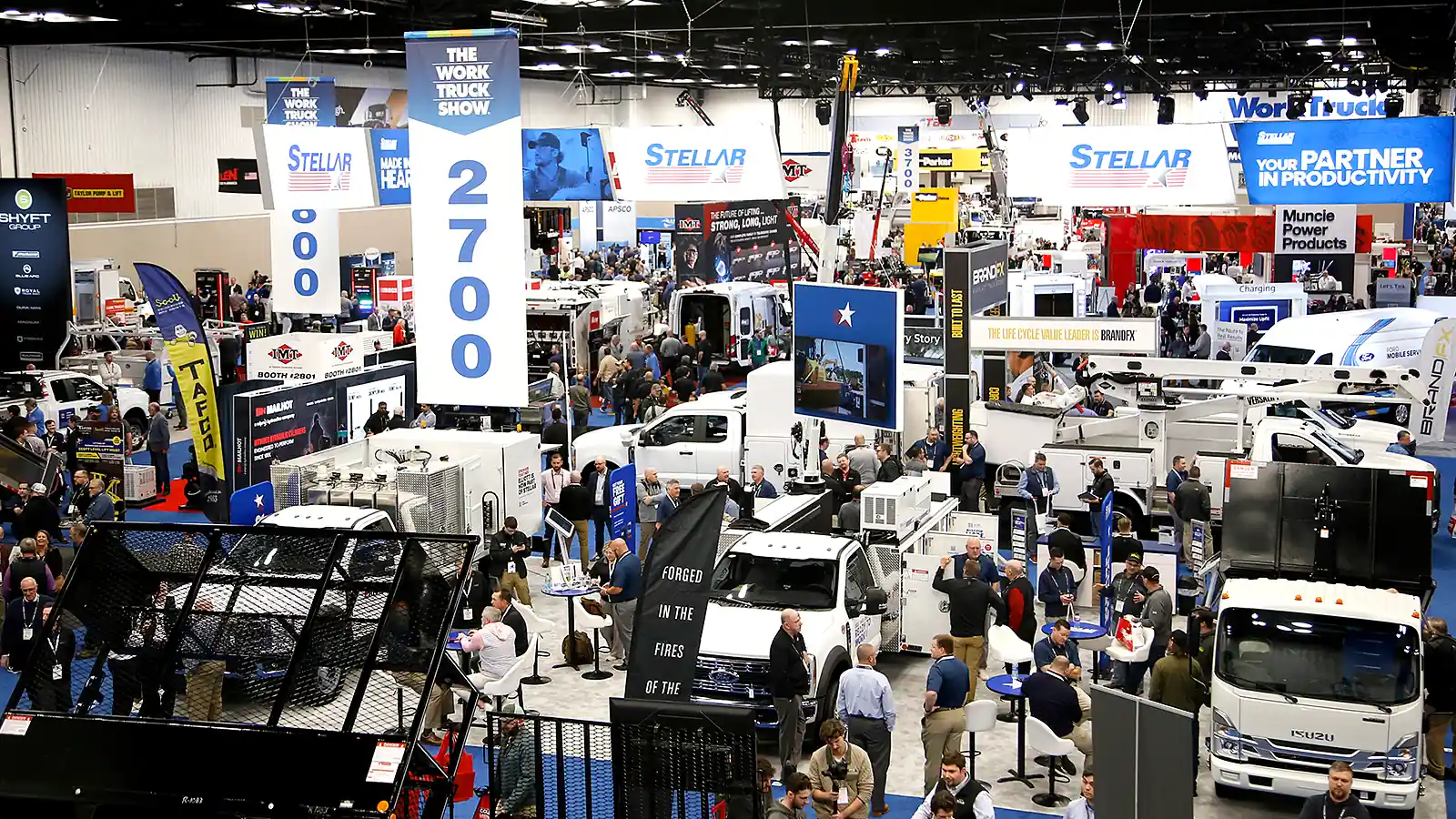 Work Truck Week exhibit floor in Indianapolis with commercial vehicles and attendees