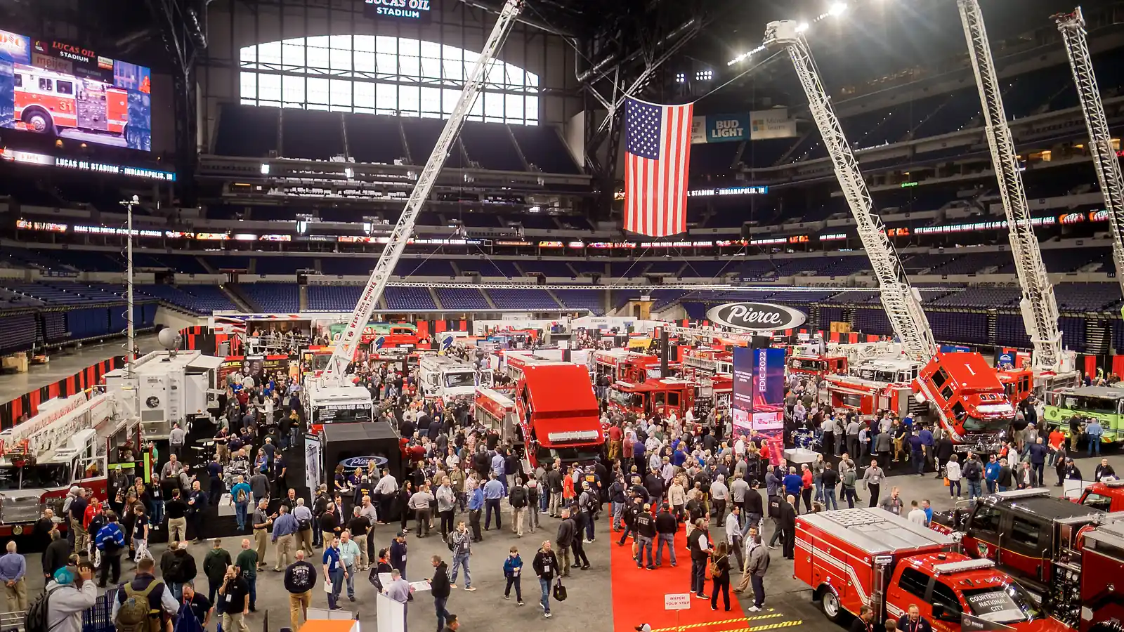 FDIC International exhibit floor in Indianapolis with fire apparatus and responders