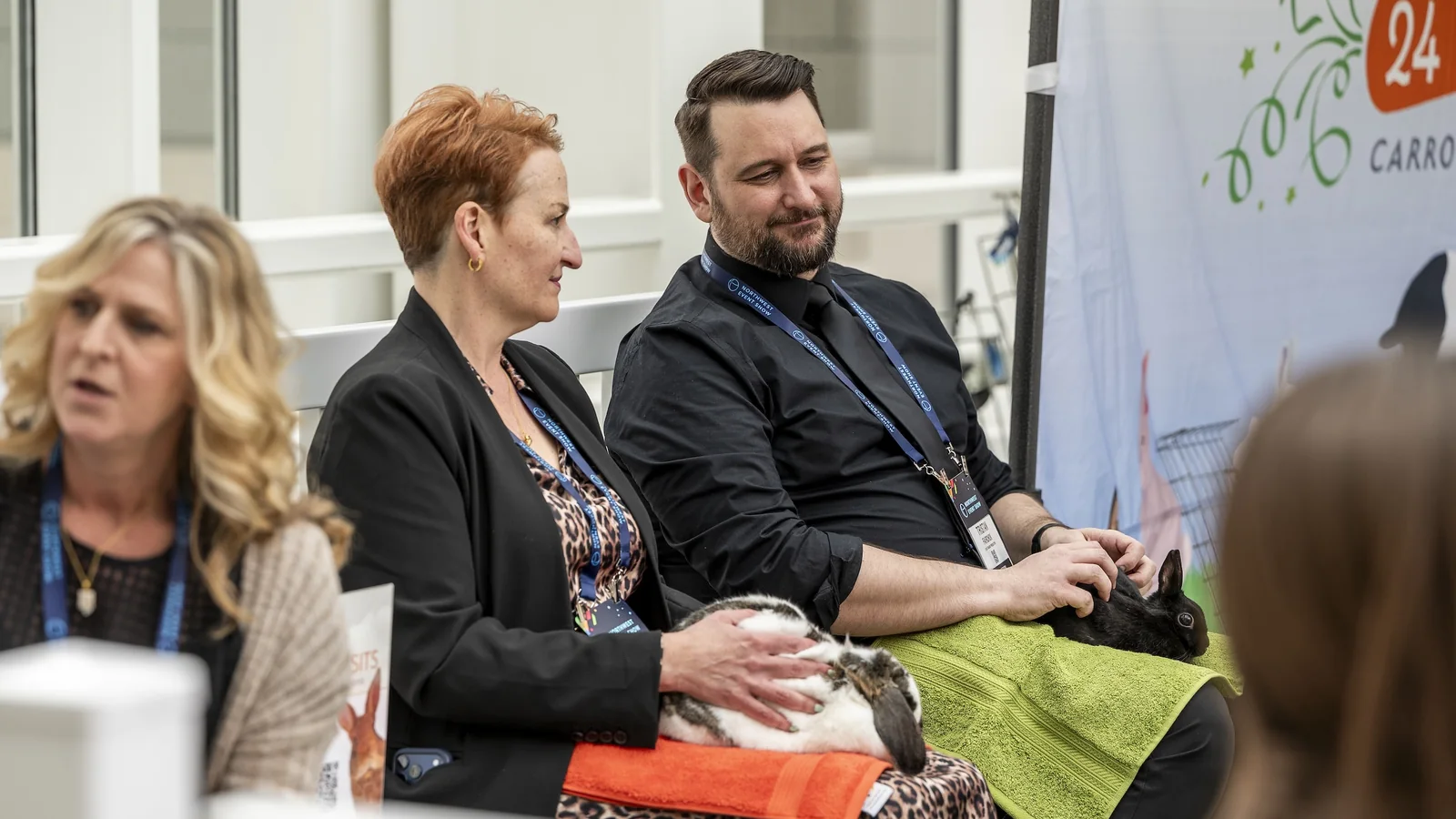Exhibitor speaking with a visitor at the Northwest Event Show