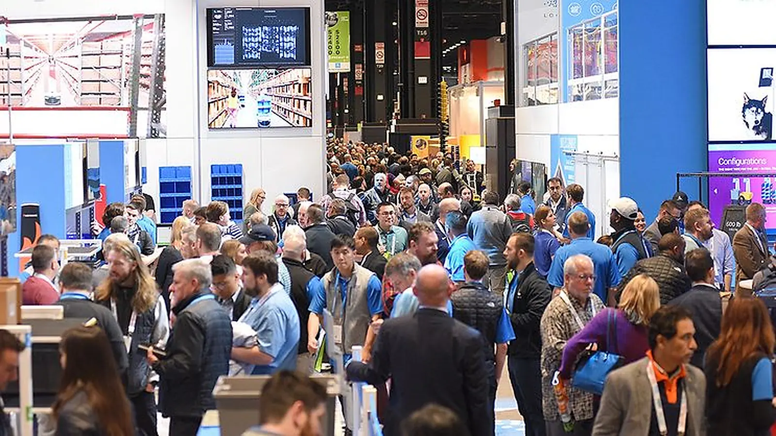 Material handling exhibitors and attendees fill the ProMat show floor in Chicago.