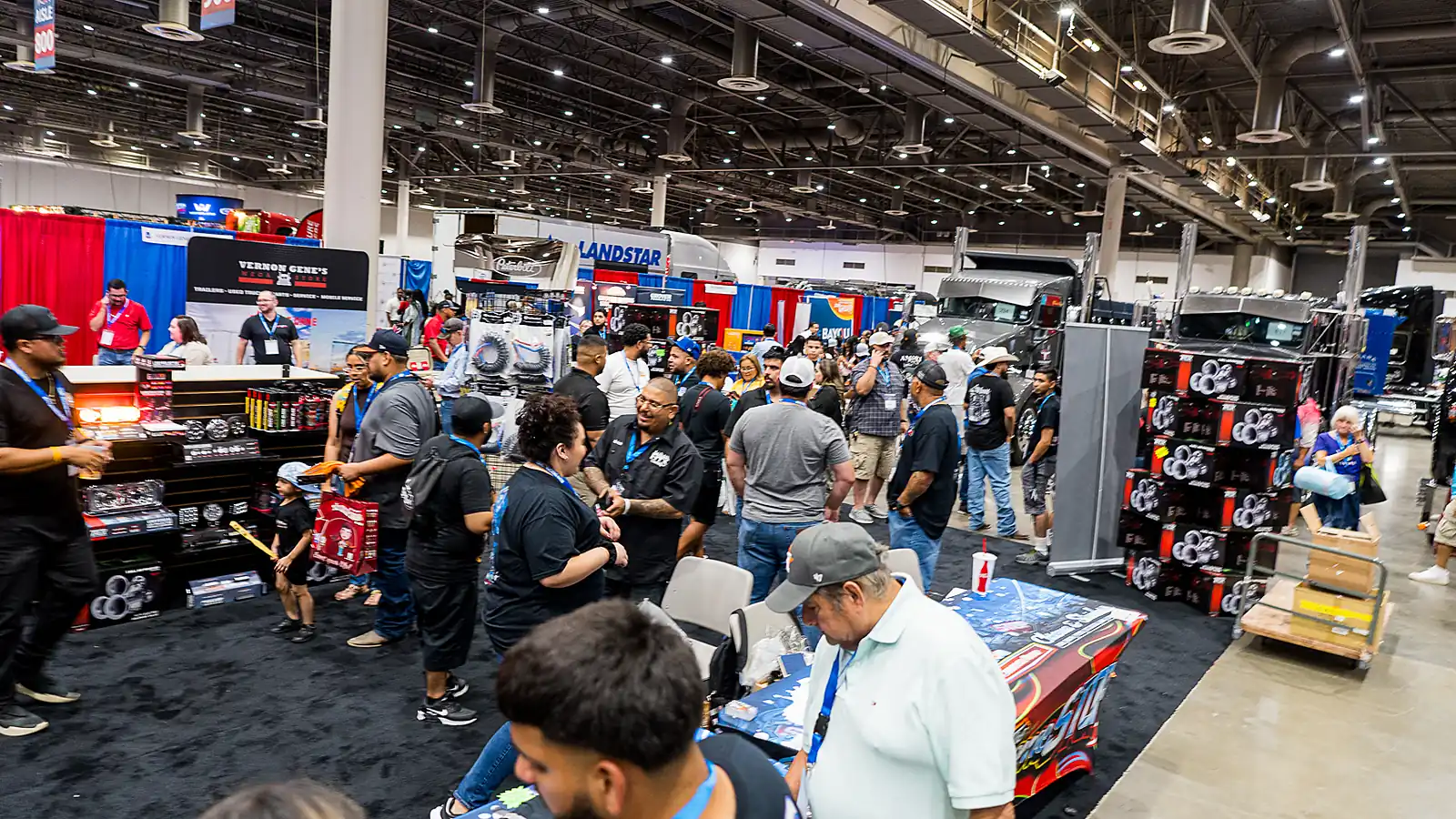 Trucks, parts booths and visitors fill the Texas Trucking Show floor in Houston.