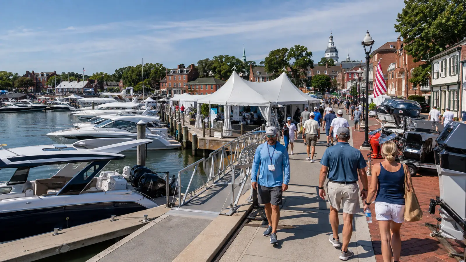 Visitors moving between docks, tents, and street exhibits at a waterfront boat show