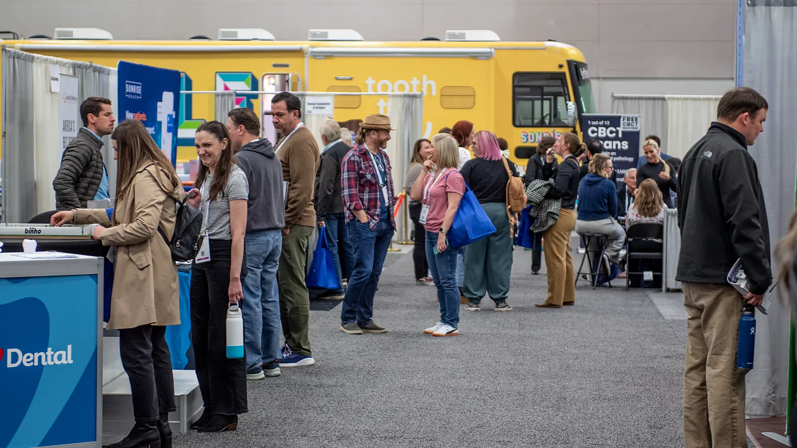 Oregon Dental Conference exhibit hall with dental suppliers and attendees