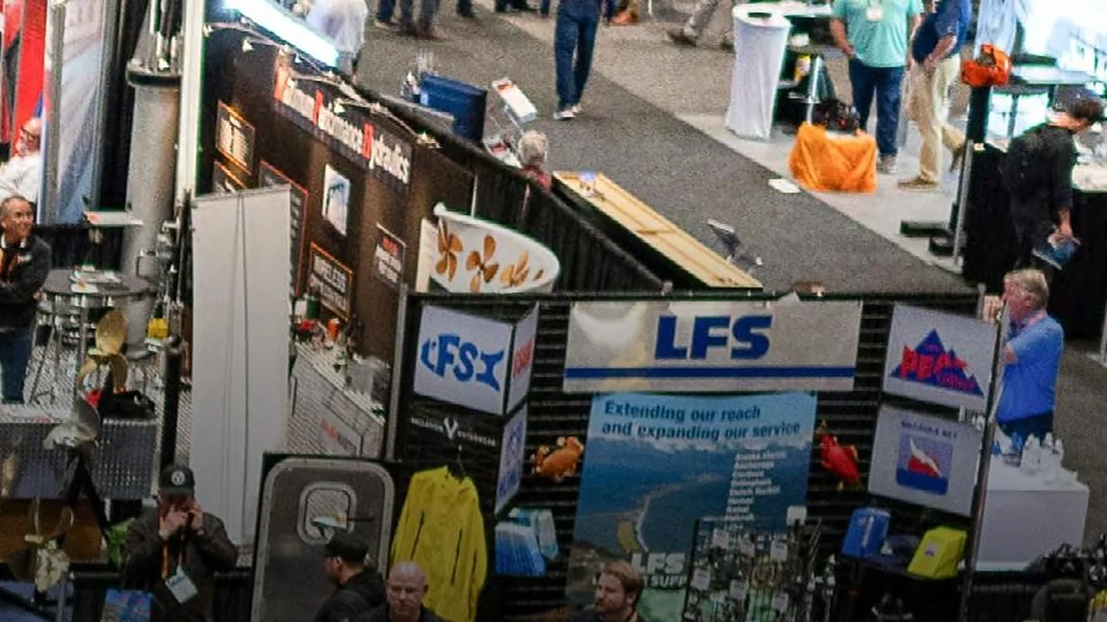 Marine industry buyers visit equipment booths on the Pacific Marine Expo show floor in Seattle.