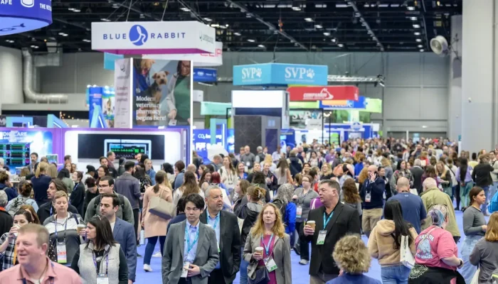 VMX veterinary conference expo hall with animal health exhibitors and attendees