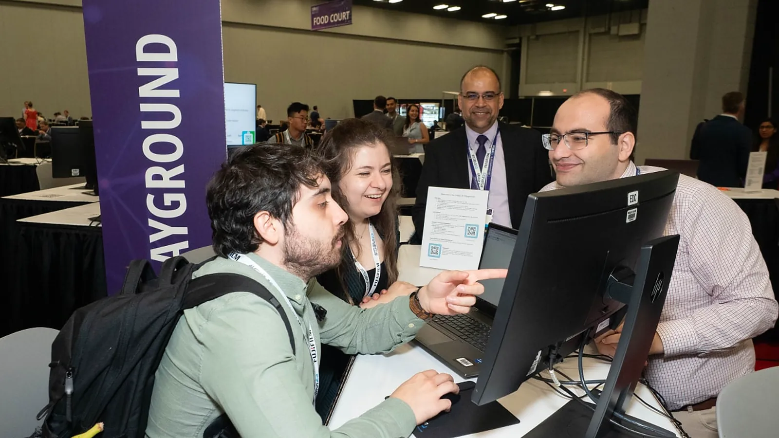 SIIM Annual Meeting InformaticsTECH Expo attendees at the AI Playground