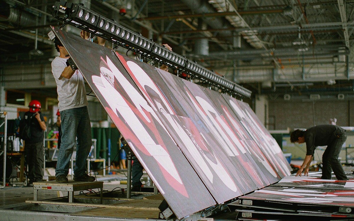 wide inline display frame standing on a workshop floor