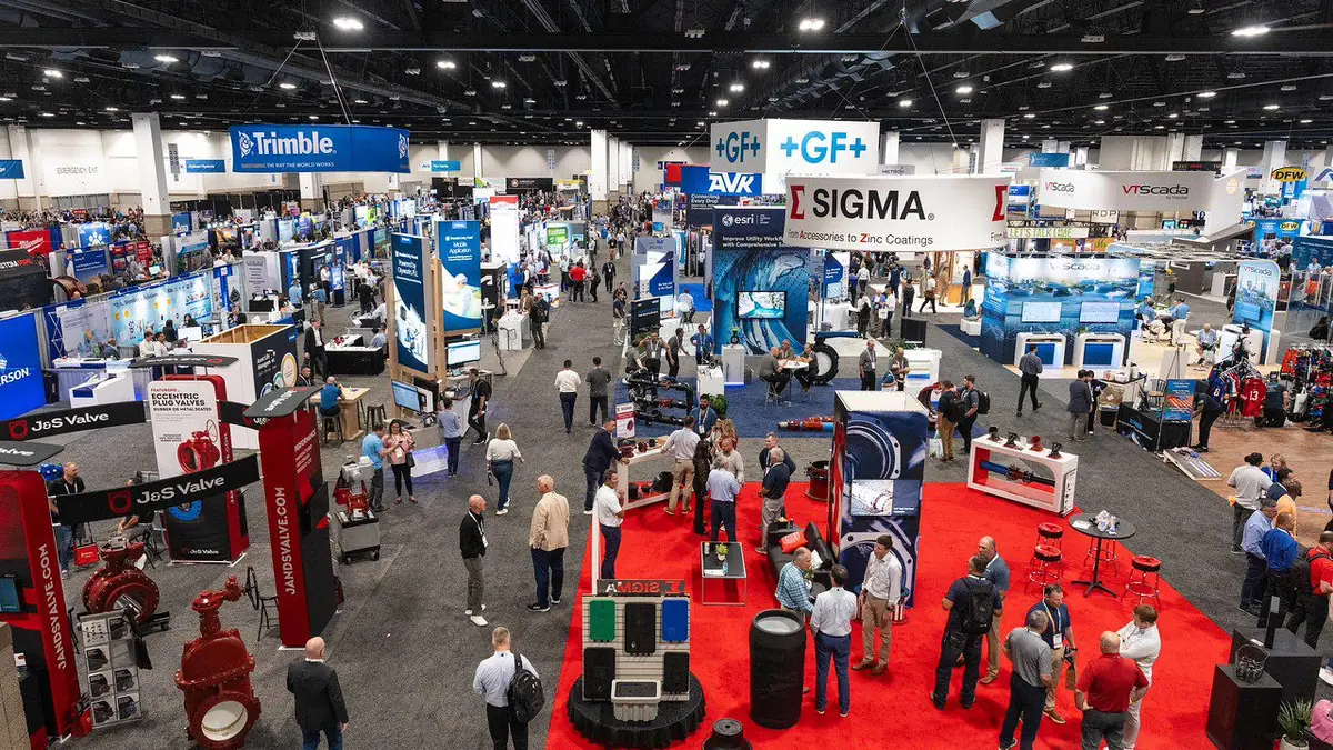 Overhead view of exhibitors and attendees in a previous AWWA ACE exhibit hall.