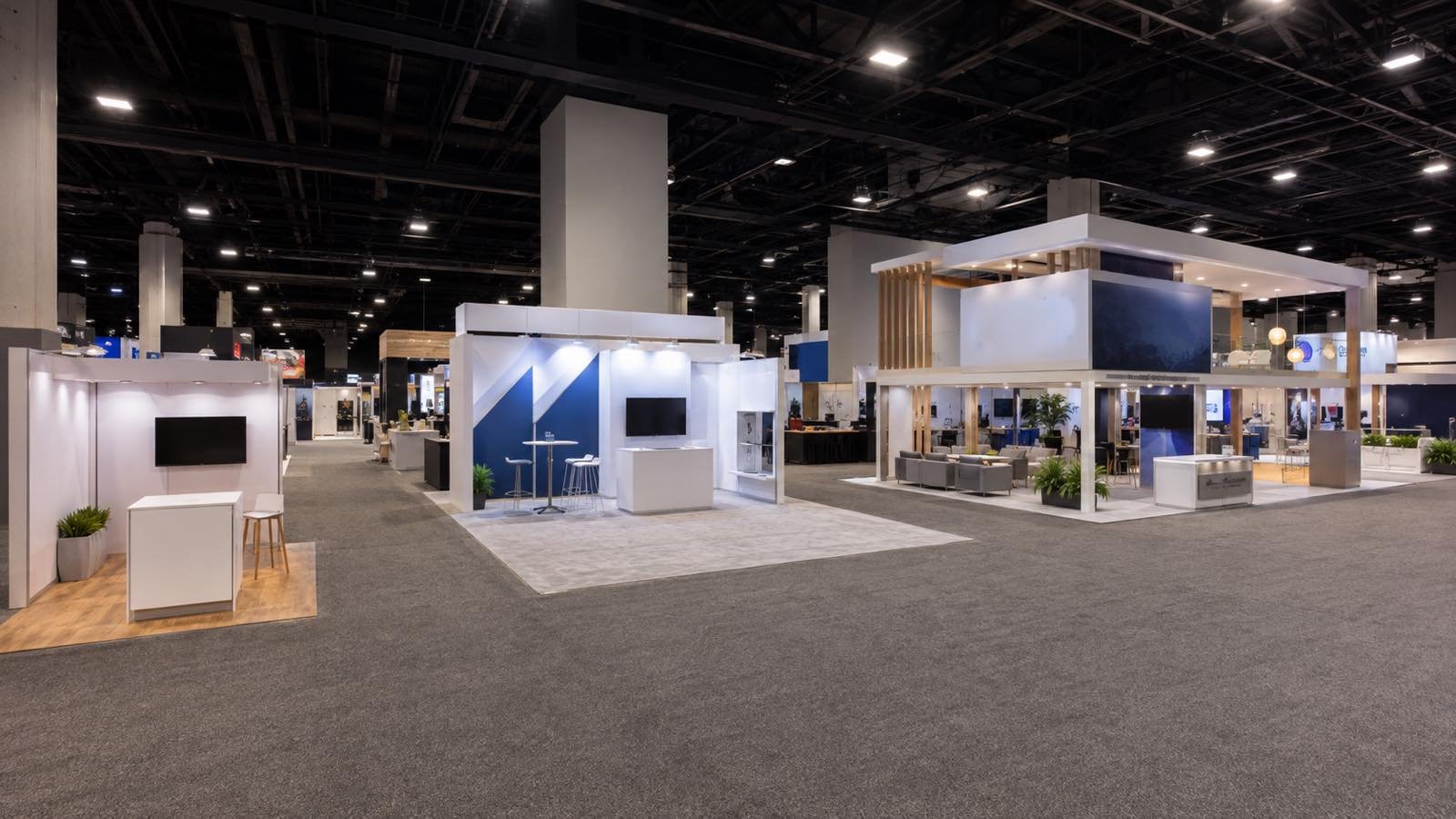 Inline, corner, and island trade show booth configurations on a convention floor