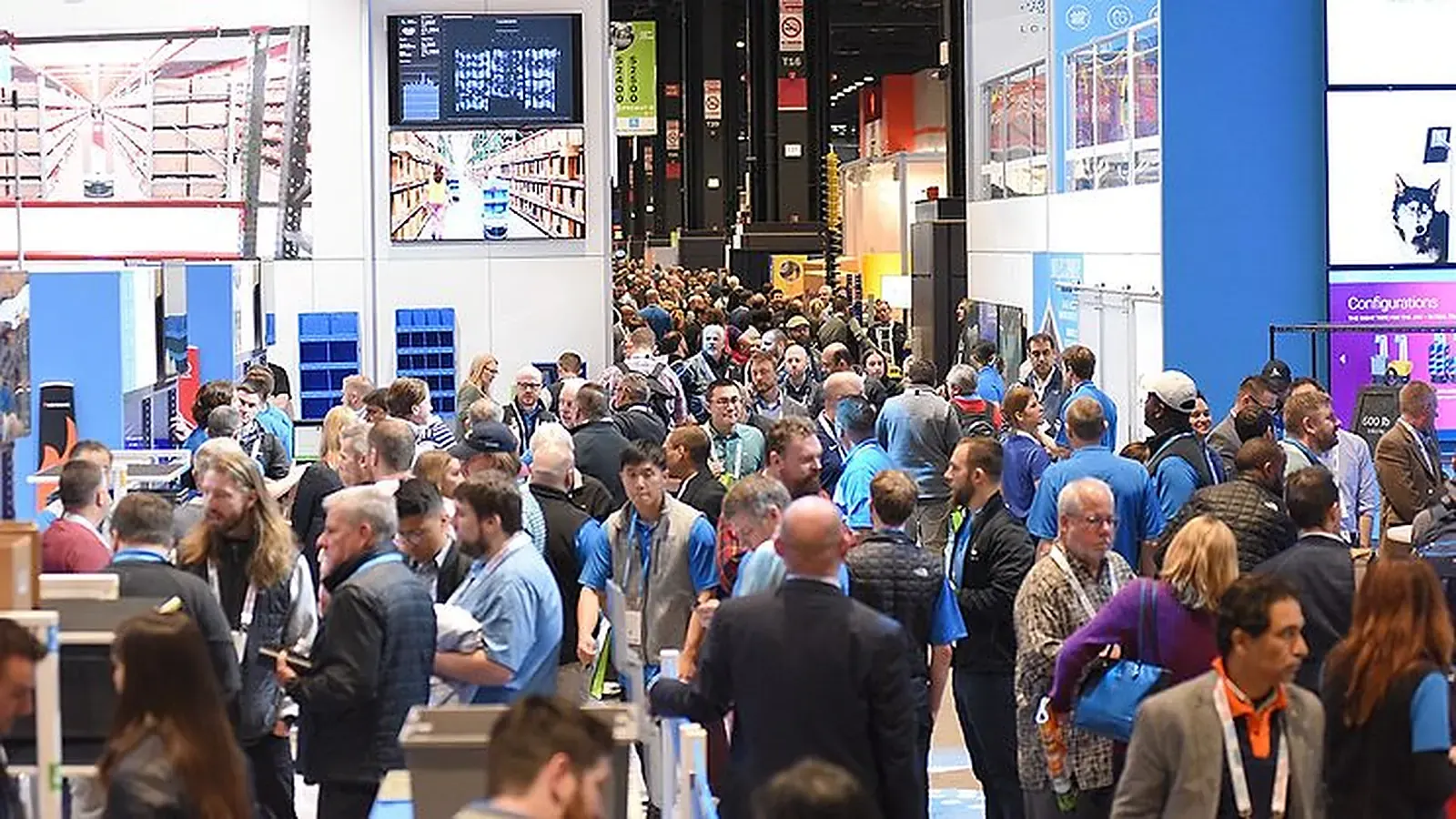 Material handling exhibitors and attendees fill the ProMat show floor in Chicago.