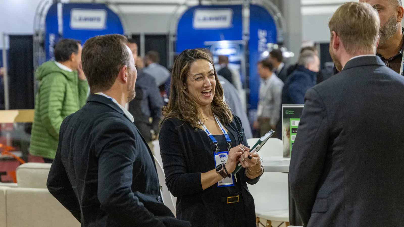Attendees talking on the exhibition floor at IPPE 2026