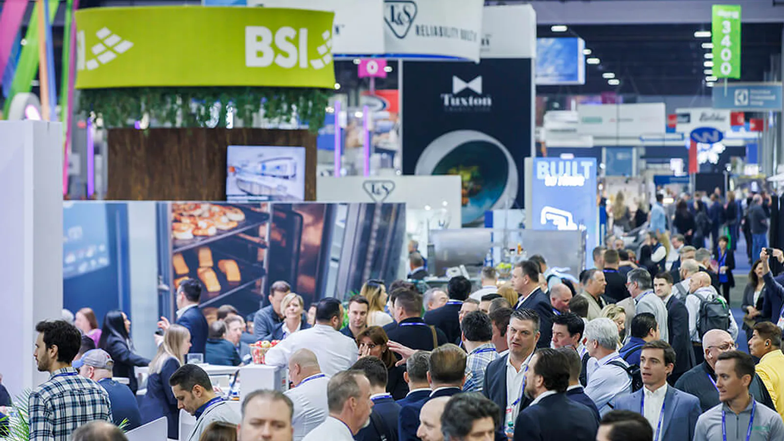 Crowded foodservice equipment exhibition floor at The NAFEM Show 2025