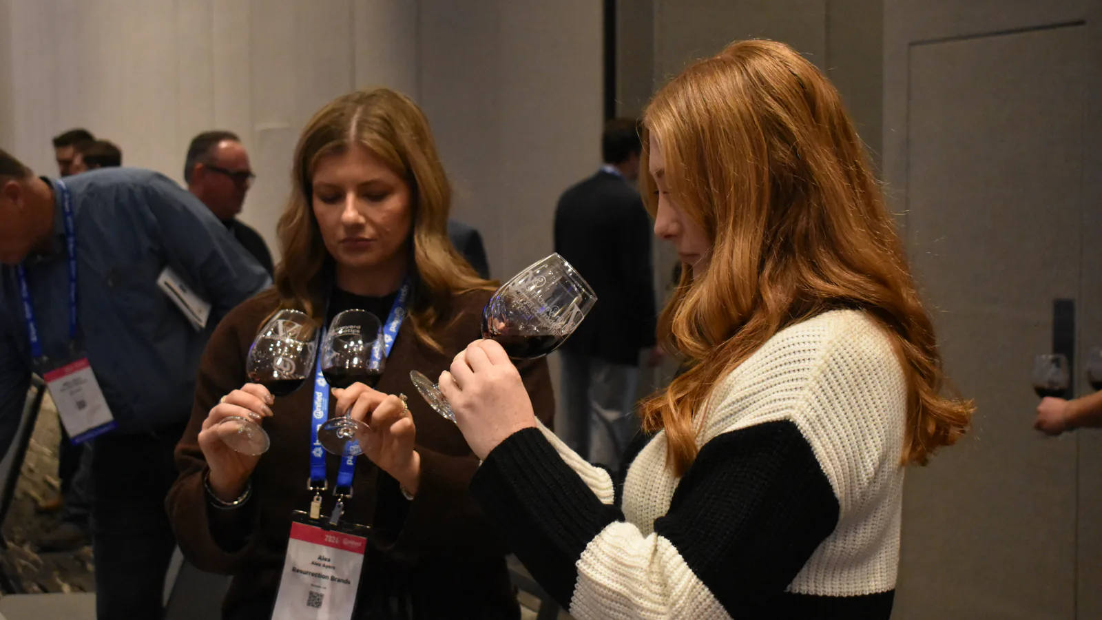 Attendees inspect wine samples at the Unified Wine and Grape Symposium