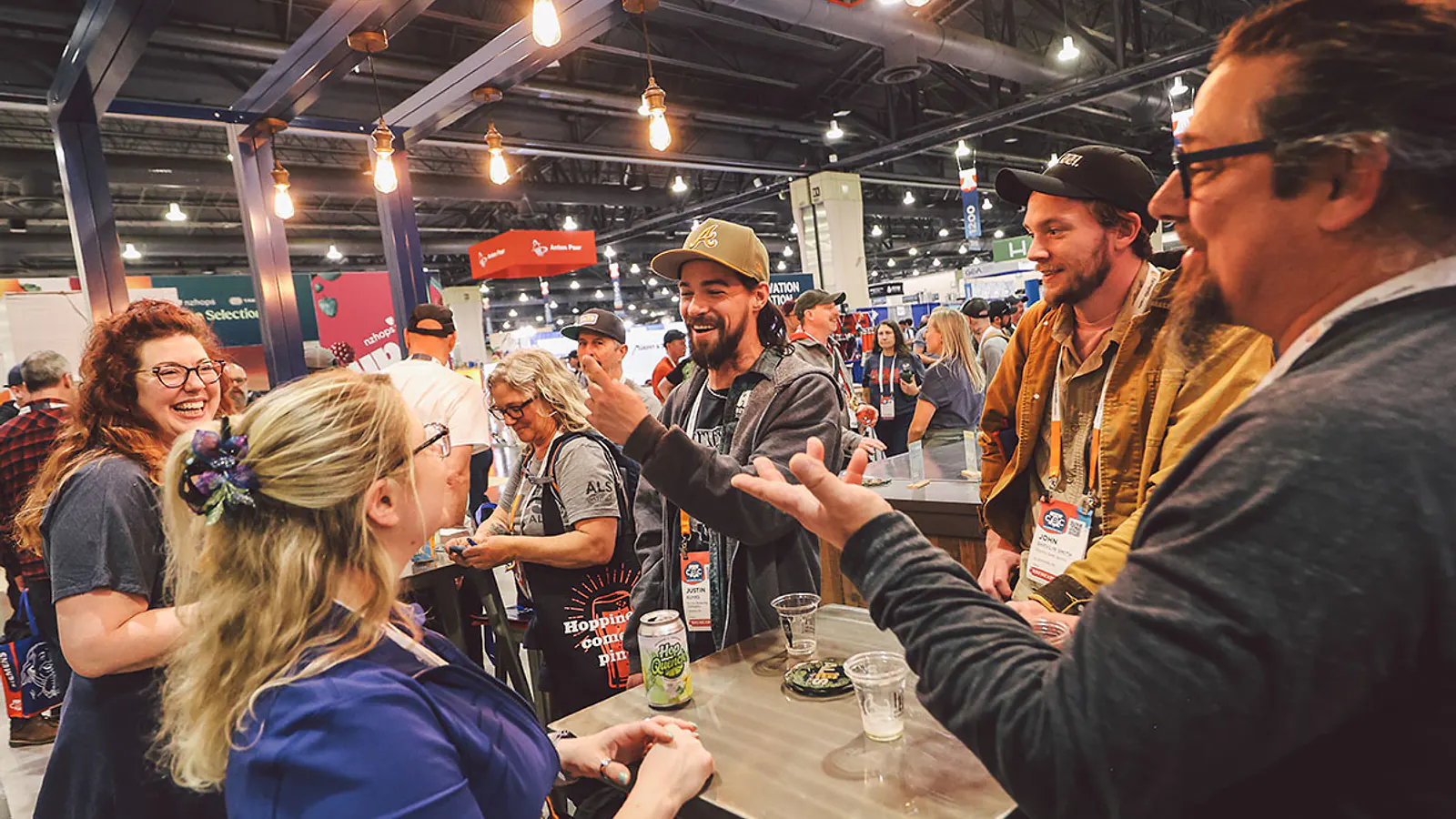 Attendees and exhibitors talk on the BrewExpo America show floor at CBC 2026