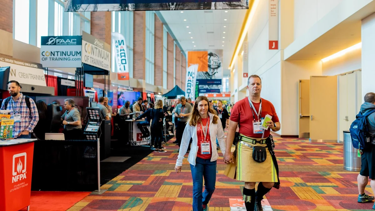 Fire and rescue professionals walking through a previous FDIC International exhibition.