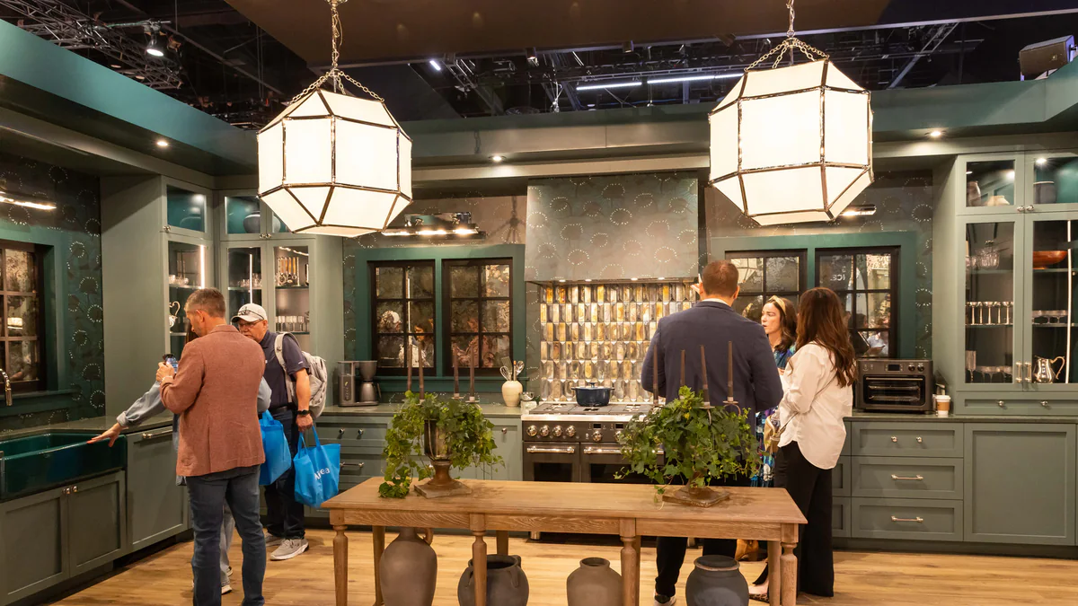Visitors exploring a kitchen display at a previous KBIS show.