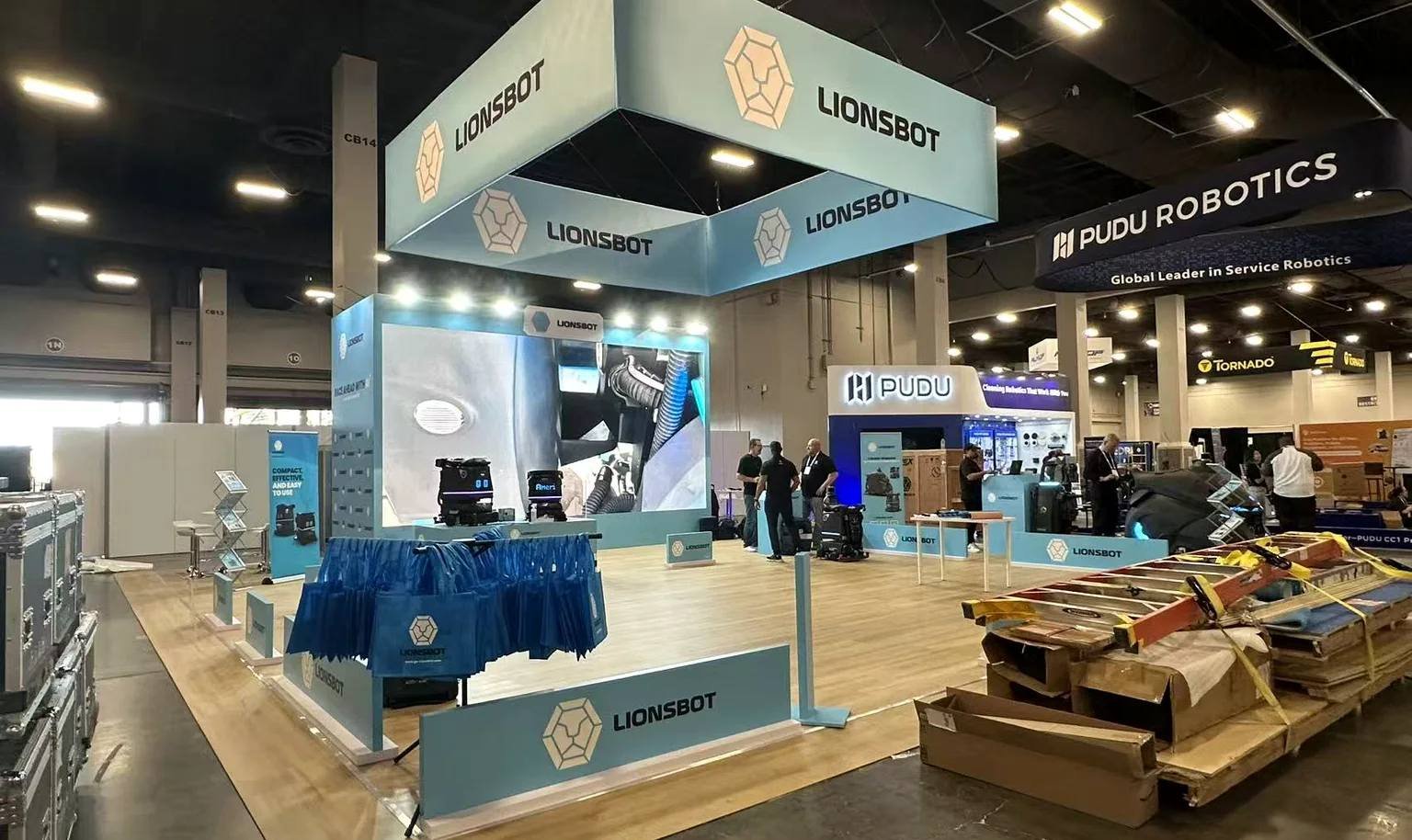 LionsBot ISSA booth showing a broad cleaning robot display for distributor product discussions