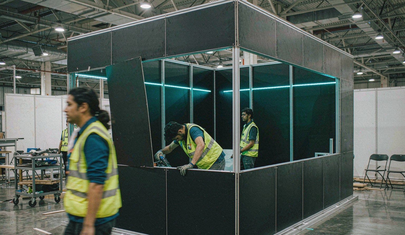 Booth wall panels with accent lighting being assembled in the fabrication workshop - Exhibit Fabrication