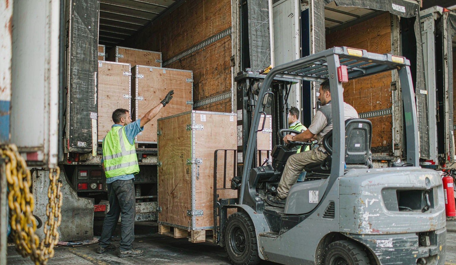 Crated booth sections on the loading dock being loaded into a trailer - Trade Show Logistics