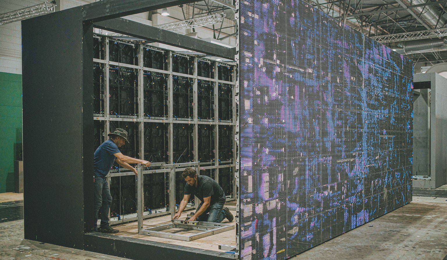 Booth wall substructure built to carry a large LED screen, frame alignment check - Trade Show Video Wall Rental