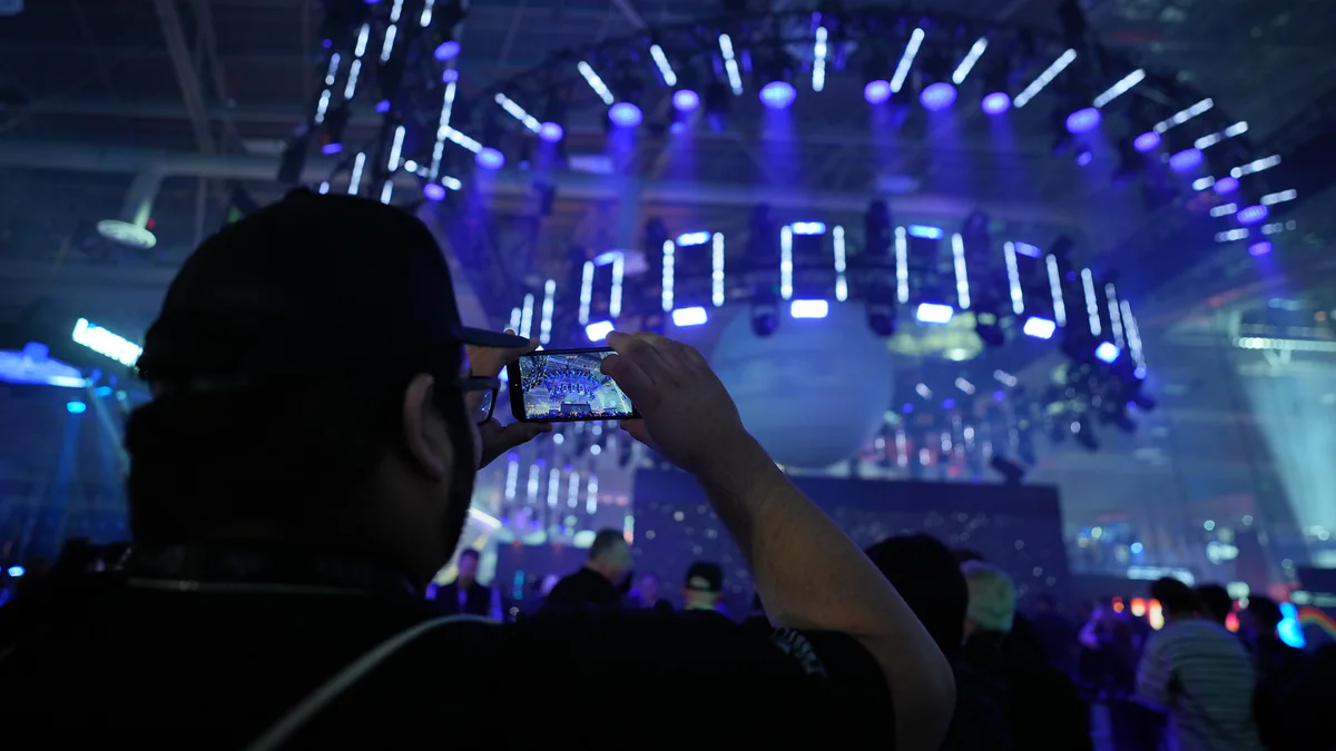 An audience watching a stage production at a previous LDI Show.