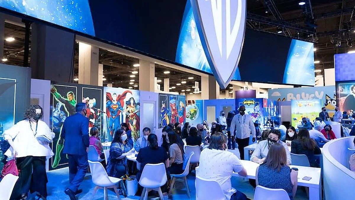 Attendees meeting with exhibitors on a previous Licensing Expo show floor.