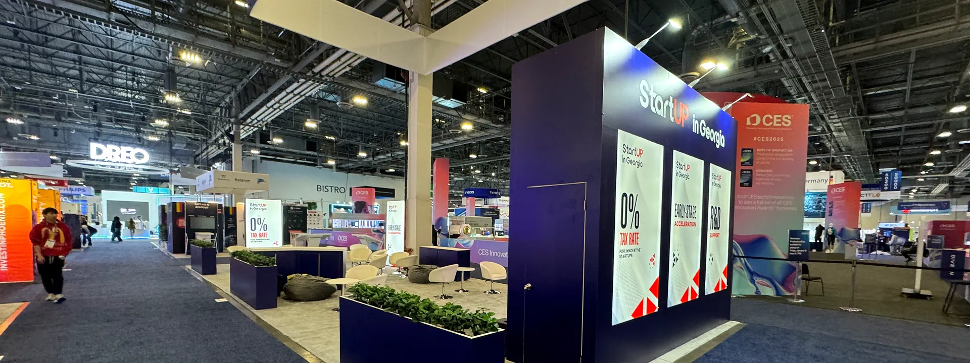 Georgia technology pavilion with illuminated counters and upright digital displays