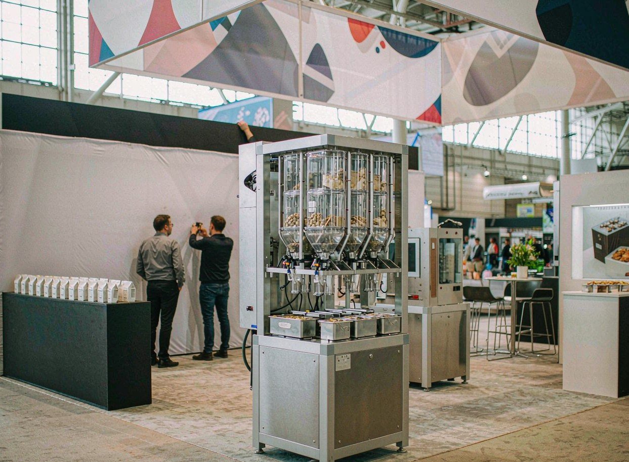Senzani — 20×30 Exhibit at PACK EXPO 2025 - Miami Beach trade show booth rental