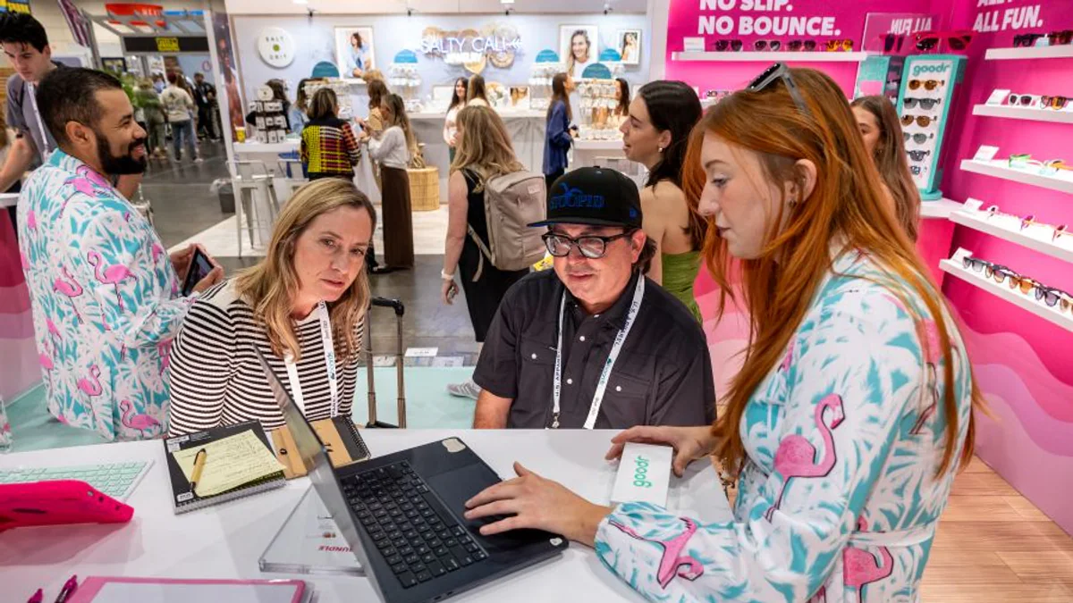 Retail buyers and exhibitors meeting at a previous Surf Expo