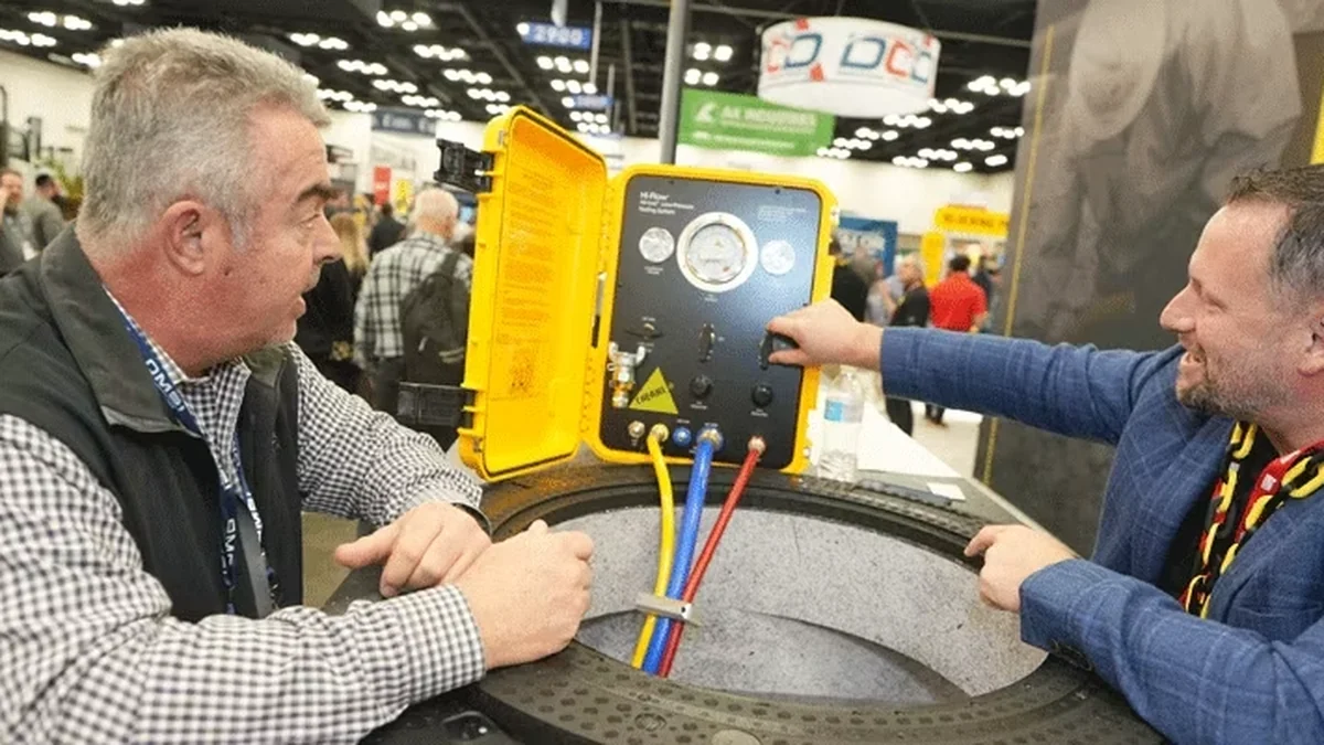 Attendees watching an equipment demonstration on a previous WWETT Show floor.